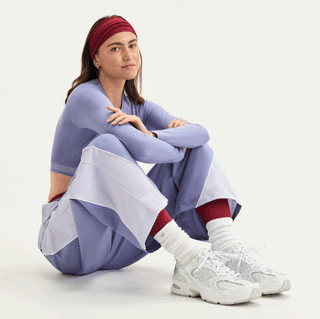 Women's polka dot-covered New Balance 530 in a clean "White/Silver Metallic" color scheme.
