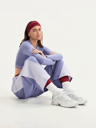 Women's polka dot-covered New Balance 530 in a clean "White/Silver Metallic" color scheme.