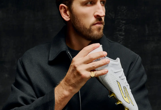 Harry Kane holding a special Skechers Ballon d'Or SKX_2 boots commemorating his 2026 win of the award. Photo via Skechers Football.
