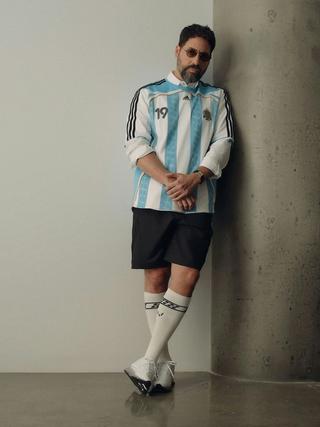 Ronnie Fieg wearing the Messi-inspired 2006 Argentina Home Jersey by Kith x adidas Football. Photo via Design District.