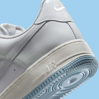 Heel close-up of Nike's Air Force 1 Low in a "White/Light Armory Blue/Photon Dust" color scheme.