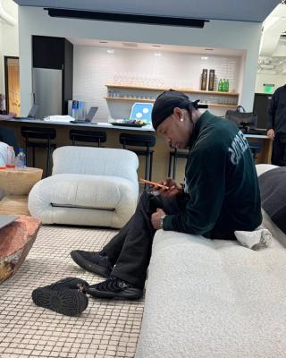 Travis Scott wearing black Nike Caitlin 1. Photo via Caitlin Clark.