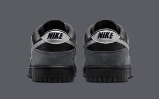 Heel angle of the Nike Dunk Low covered in a "Black/Anthracite/Metallic Dark Grey" color scheme.