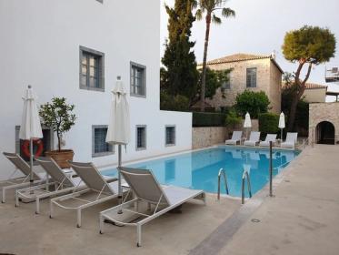 Pool and sun loungers at Orloff Resort, Old Harbour, Spetses