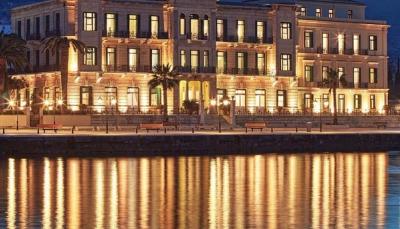 Poseidonion Grand Hotel lit up at night on the Dapia waterfront, Spetses