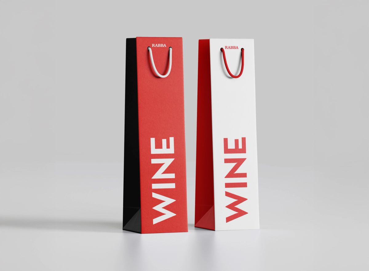 Two tall Rabba wine bags in red and white with vertical WINE type