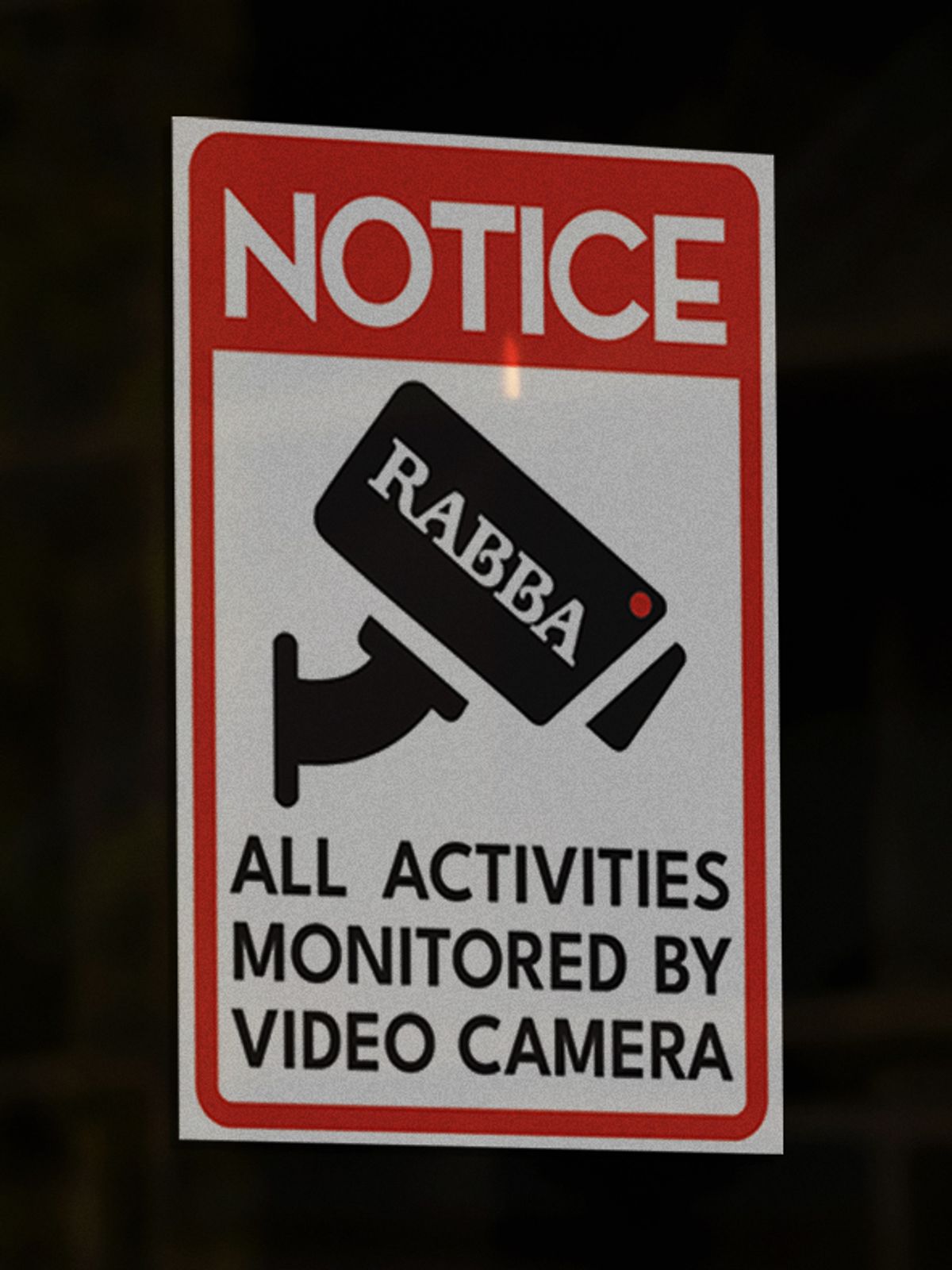 Rabba-branded notice on a store door: all activities monitored by video camera