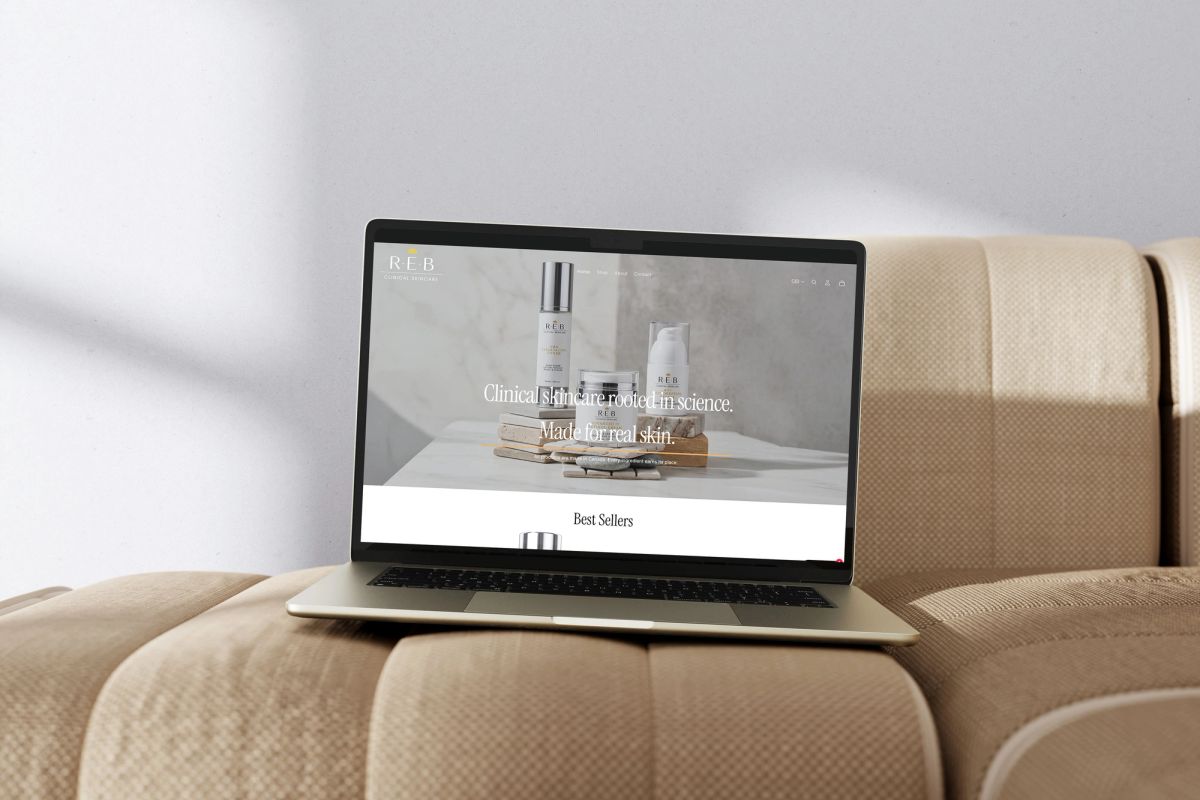 REB Clinical Skincare Shopify homepage on a laptop: hero headline Clinical skincare rooted in science, made for real skin, above a Best Sellers row