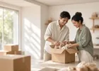 A young couple unpacking boxes while setting up their new business.