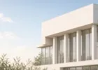 The facade of a modern institutional building under bright daylight.