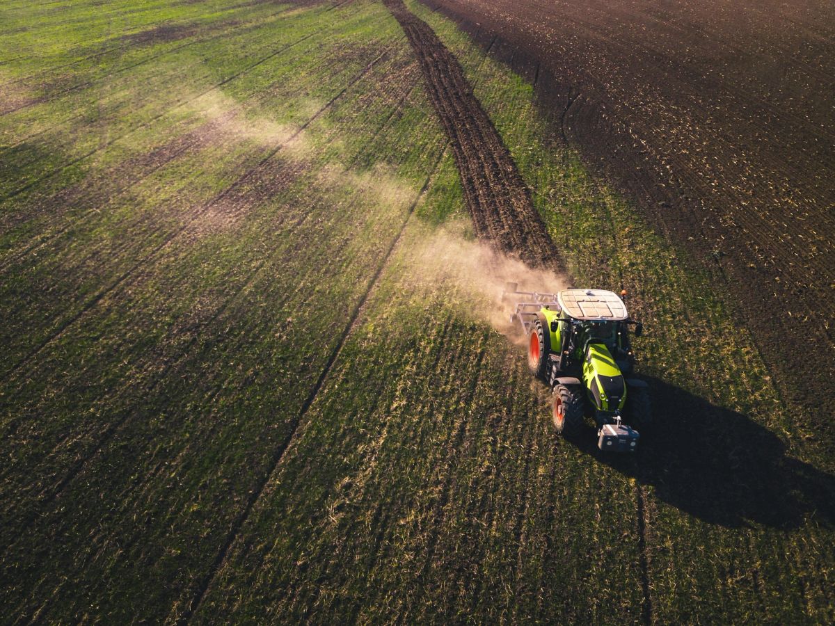 Aerial view of a tractor working a wide field