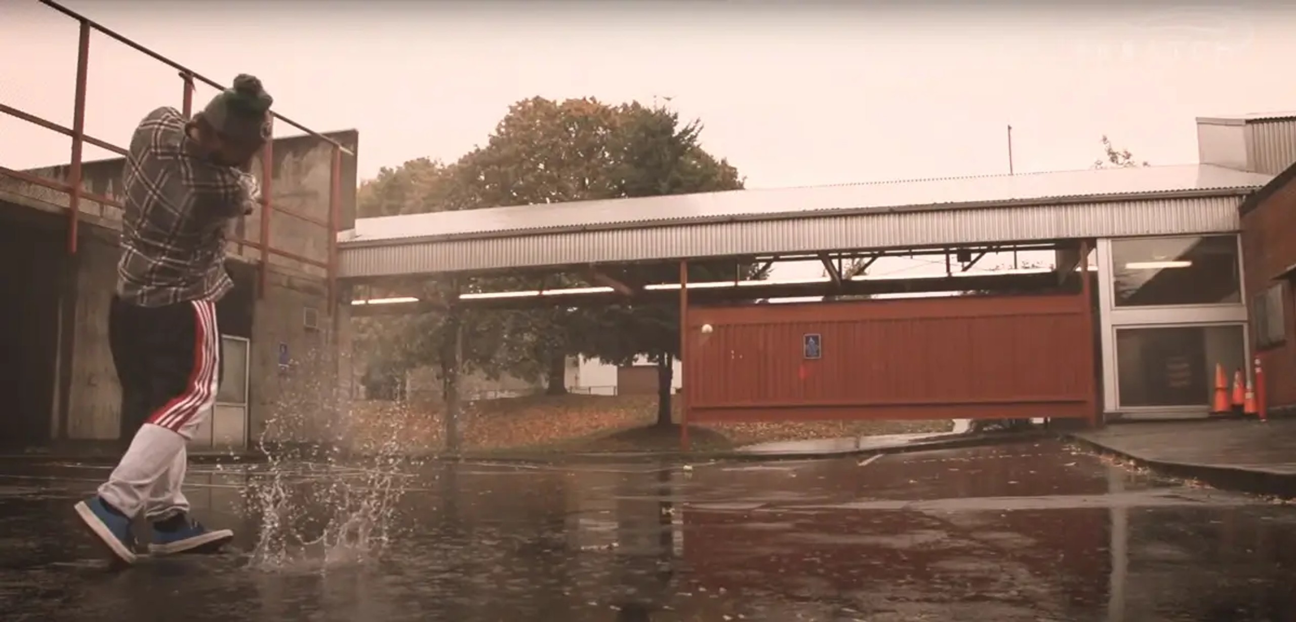 Erik Anders Lang playing street golf under the rain in Portland Oregon for a YouTube video