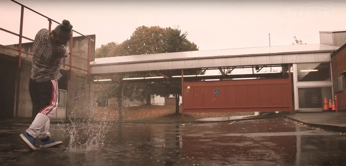 Erik Anders Lang playing street golf under the rain in Portland Oregon for a YouTube video