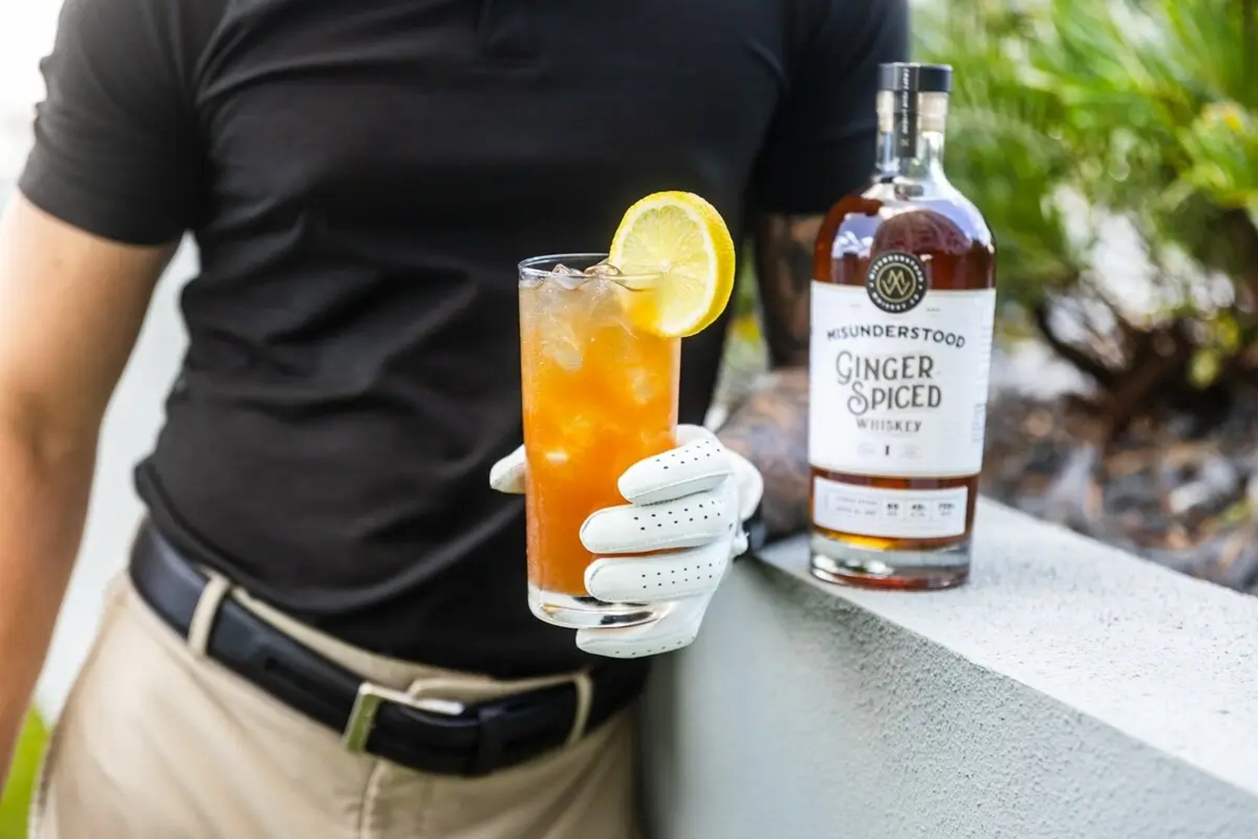 Golfer drinking a Ginger Spiced whisky cocktail