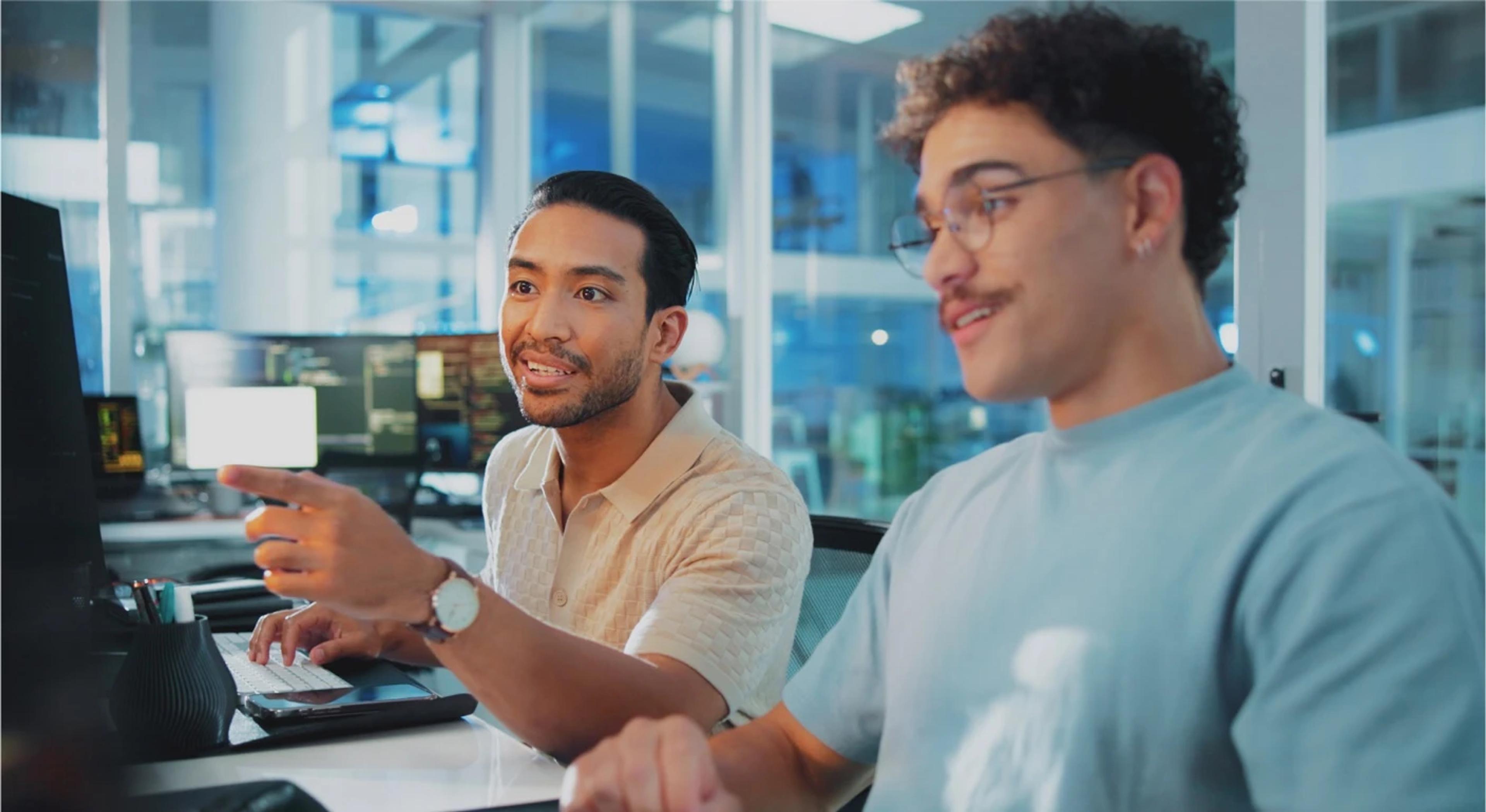 Two people working together in office