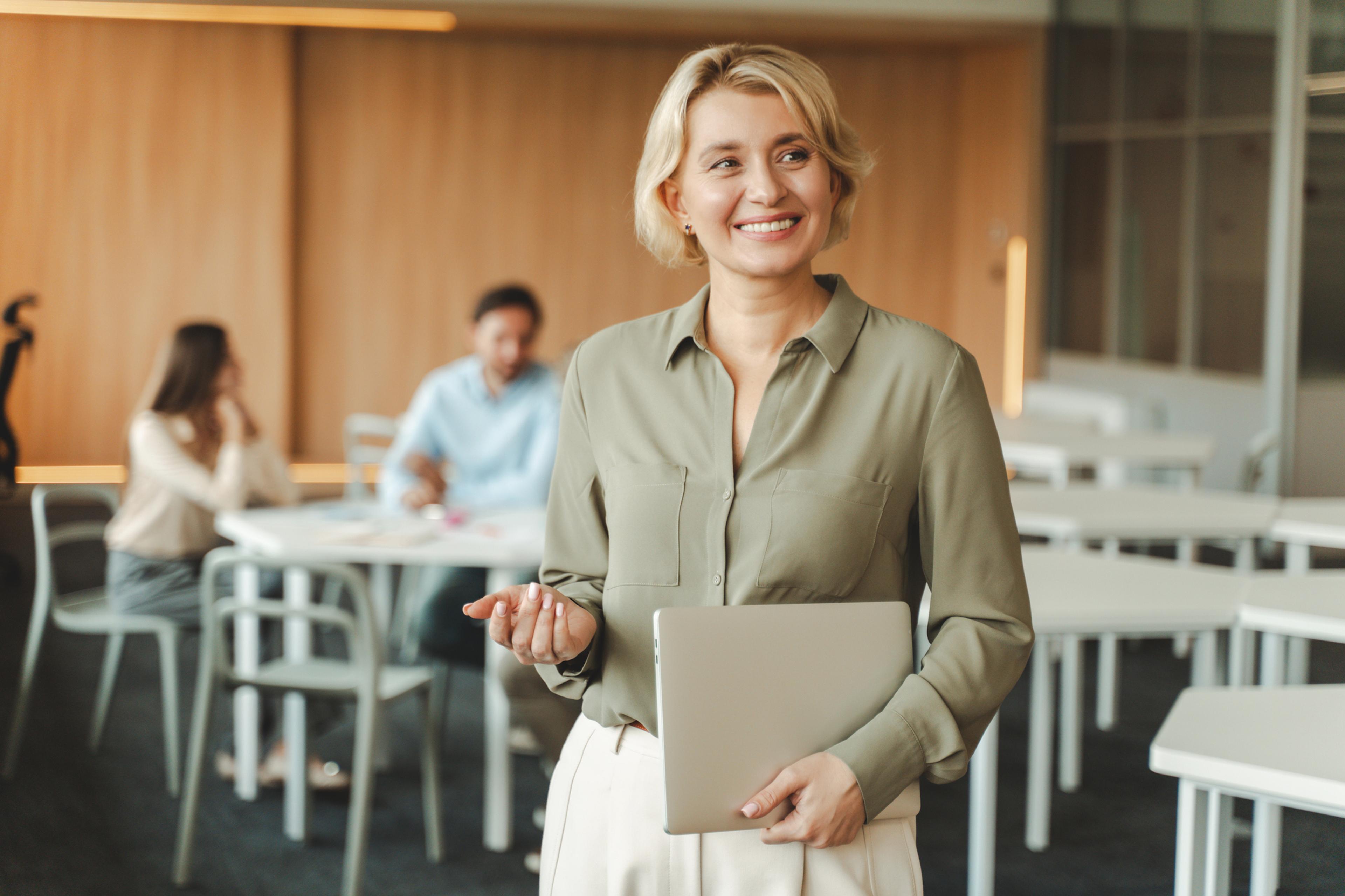Businesswoman reflecting on the impacts of AI payroll