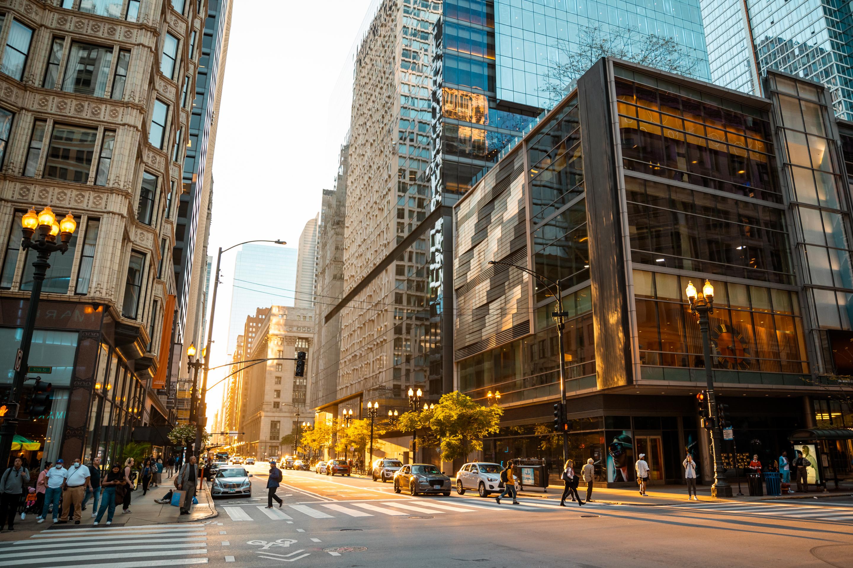 Crowded city street with pedestrians and traffic, representing the progress of nearshore software development.