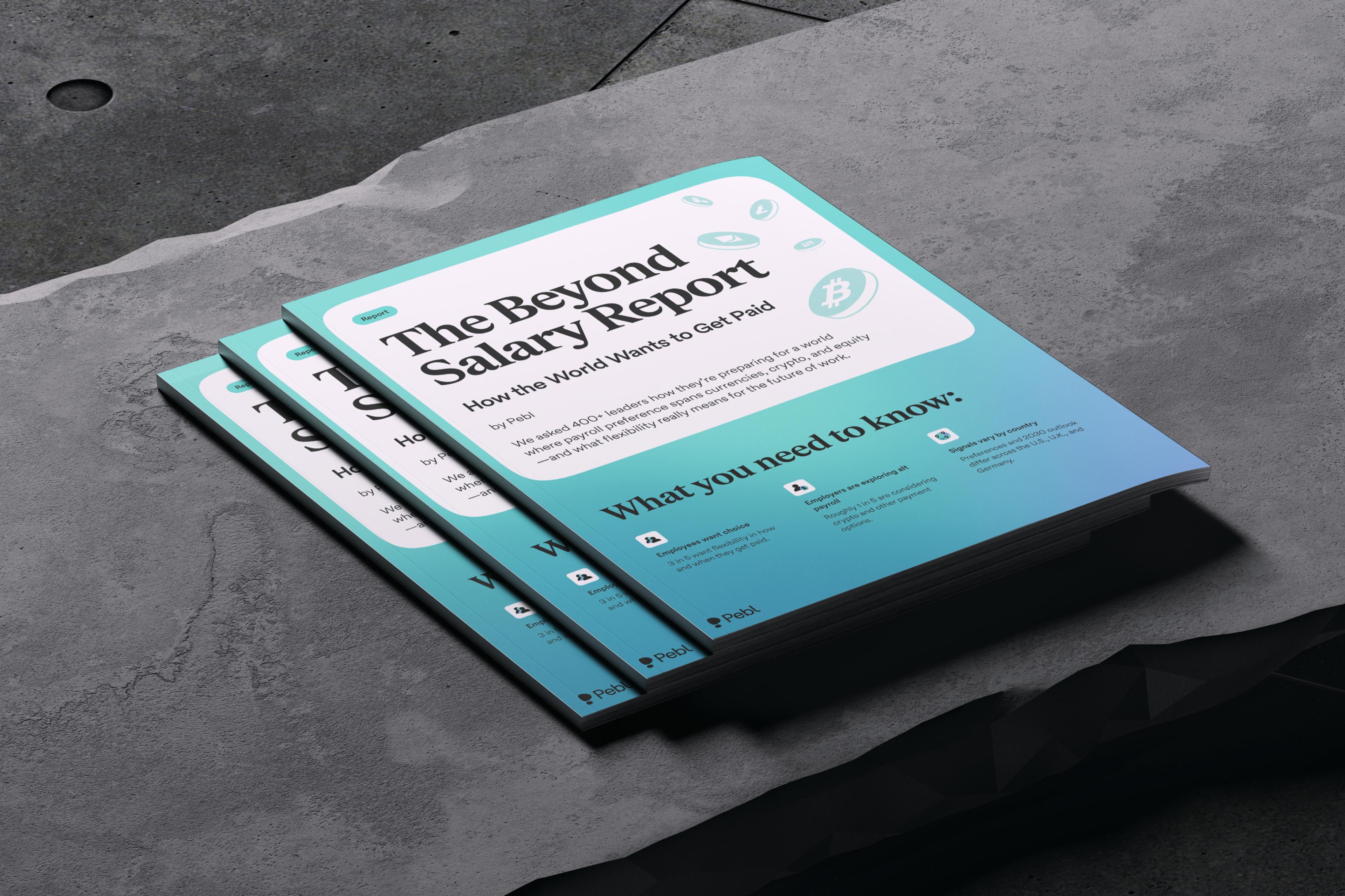 3x copies of Pebl’s The Beyond Salary Report laying stacked on a concrete bench. 
