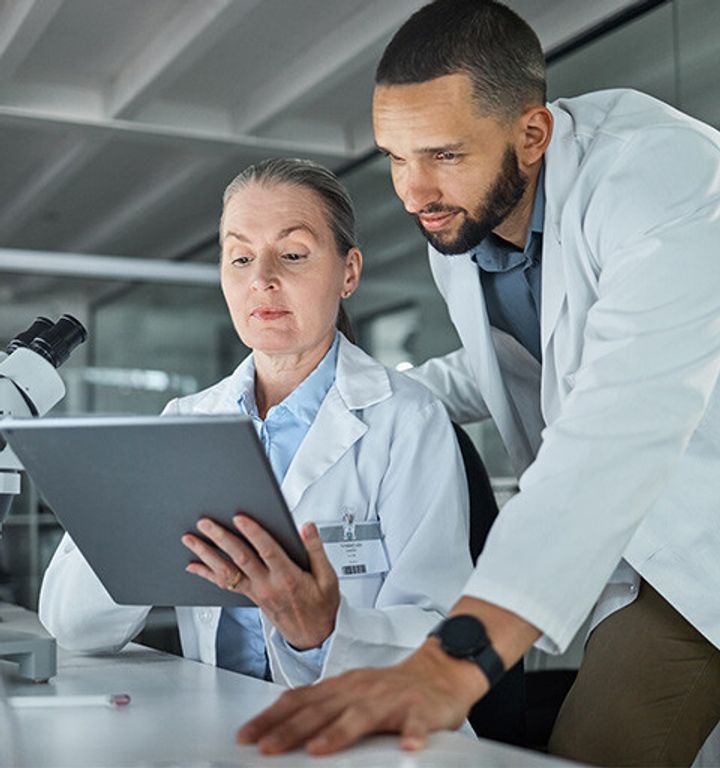Scientists working together in a lab
