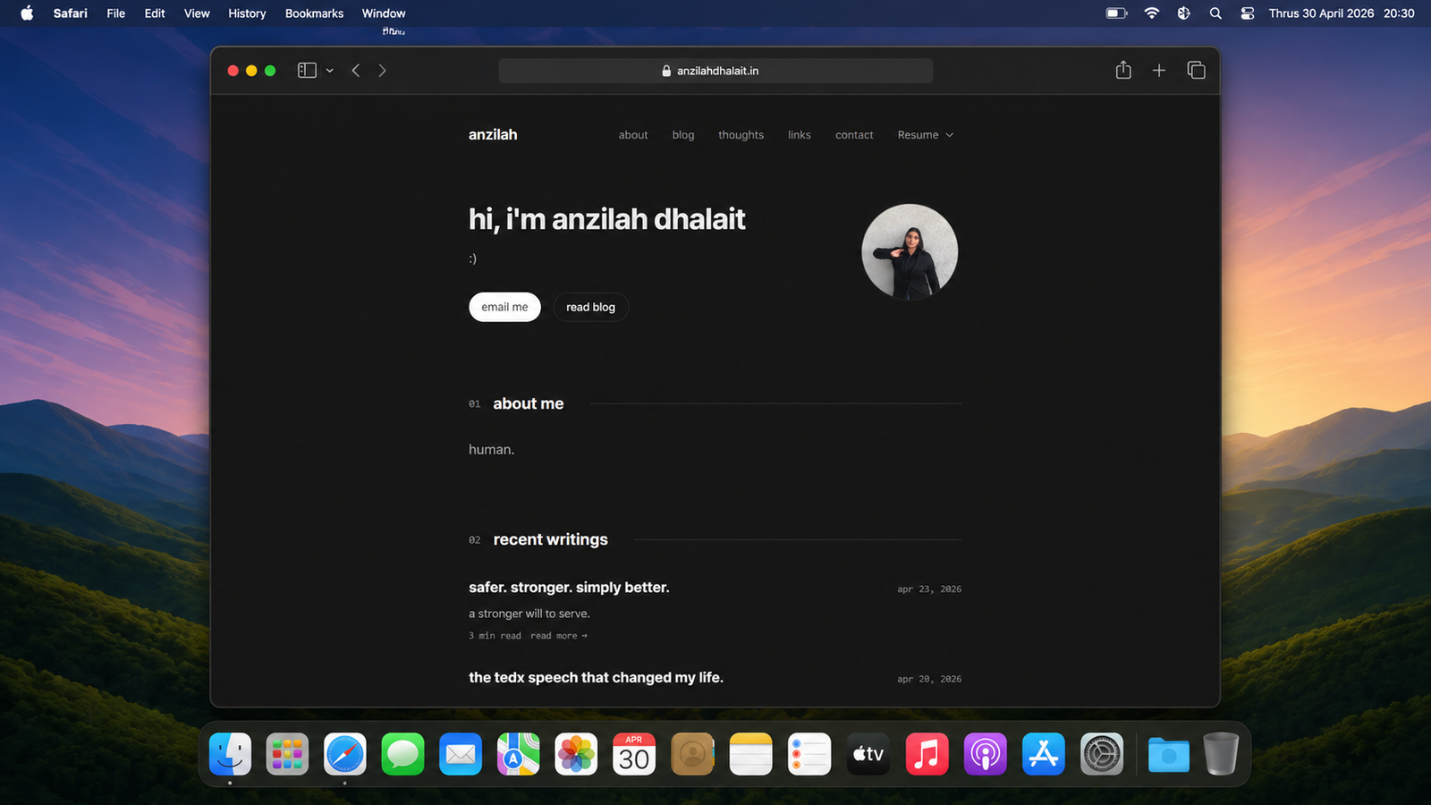 A screenshot of the personal website for Anzilah Dhalait. The page has a minimal dark design with a navigation menu at the top. It features a friendly greeting, a profile photo, and sections titled "about me" and "recent writings," which lists blog posts like "safer. stronger. simply better."