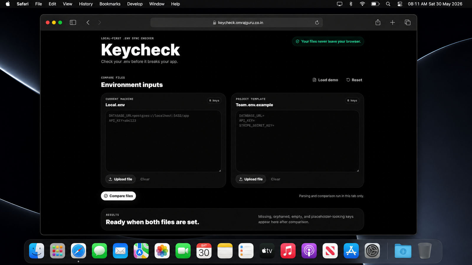 A dark-mode macOS desktop screenshot showing Safari open to keycheck.omrajguru.co.in. The Safari window displays the Keycheck web app with a black dotted background, large “Keycheck” heading, two side-by-side environment input panels labeled Local.env and Team.env.example, upload buttons, a “Compare files” button, and a results panel reading “Ready when both files are set.” The macOS menu bar at the top shows Safari as active and the time/date as 08:11 AM Sat 30 May 2026, with a translucent Dock visible at the bottom.