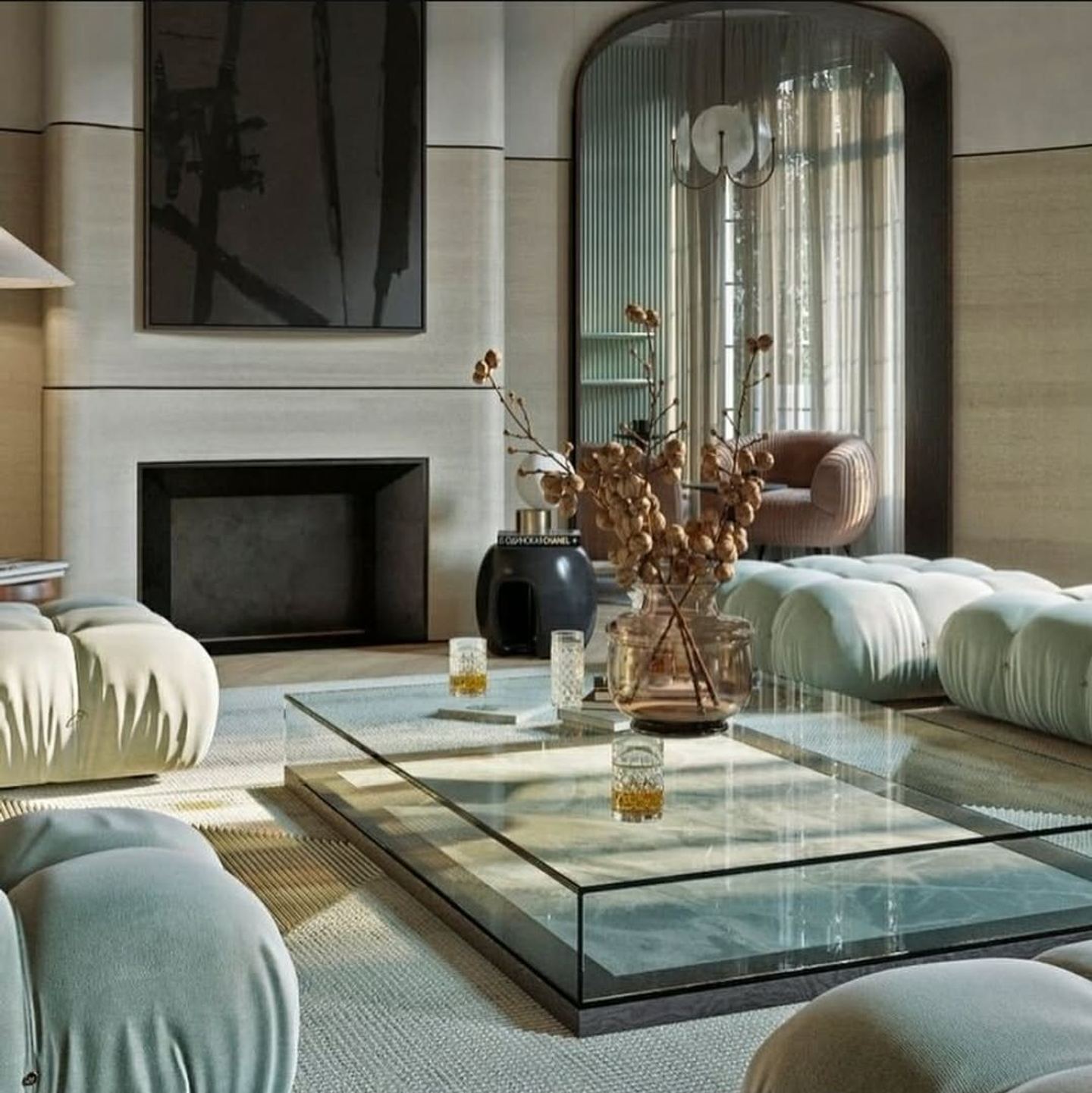 A formal living room with a stone fireplace surround and a full-height arched window