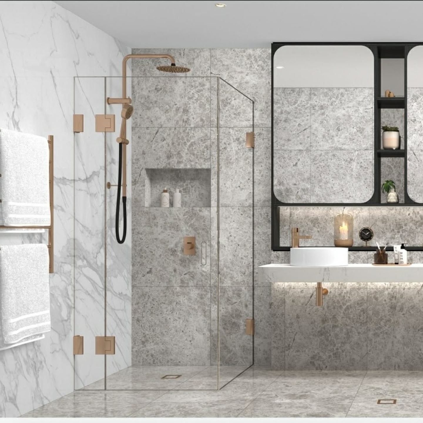 A marble ensuite with a frameless glass shower, recessed niche and brushed brass fittings