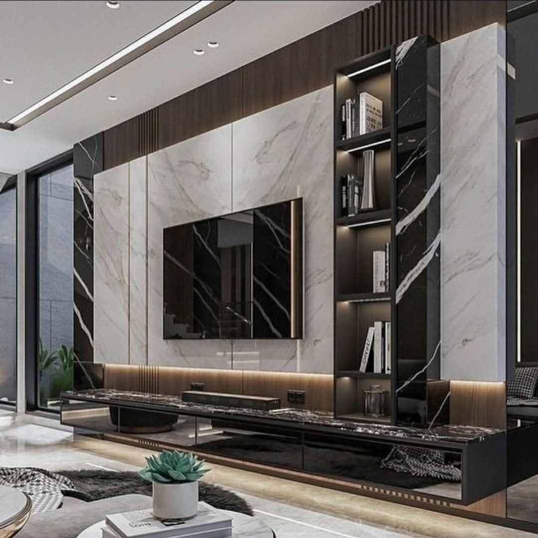 A full-height media wall in book-matched marble and dark timber joinery