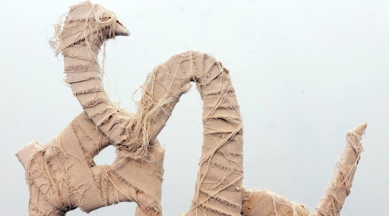 Bandaged in Spirituality — Wood wrapped in fabric, 60 × 25 × 147 cm, by Mohammad Aman Popal