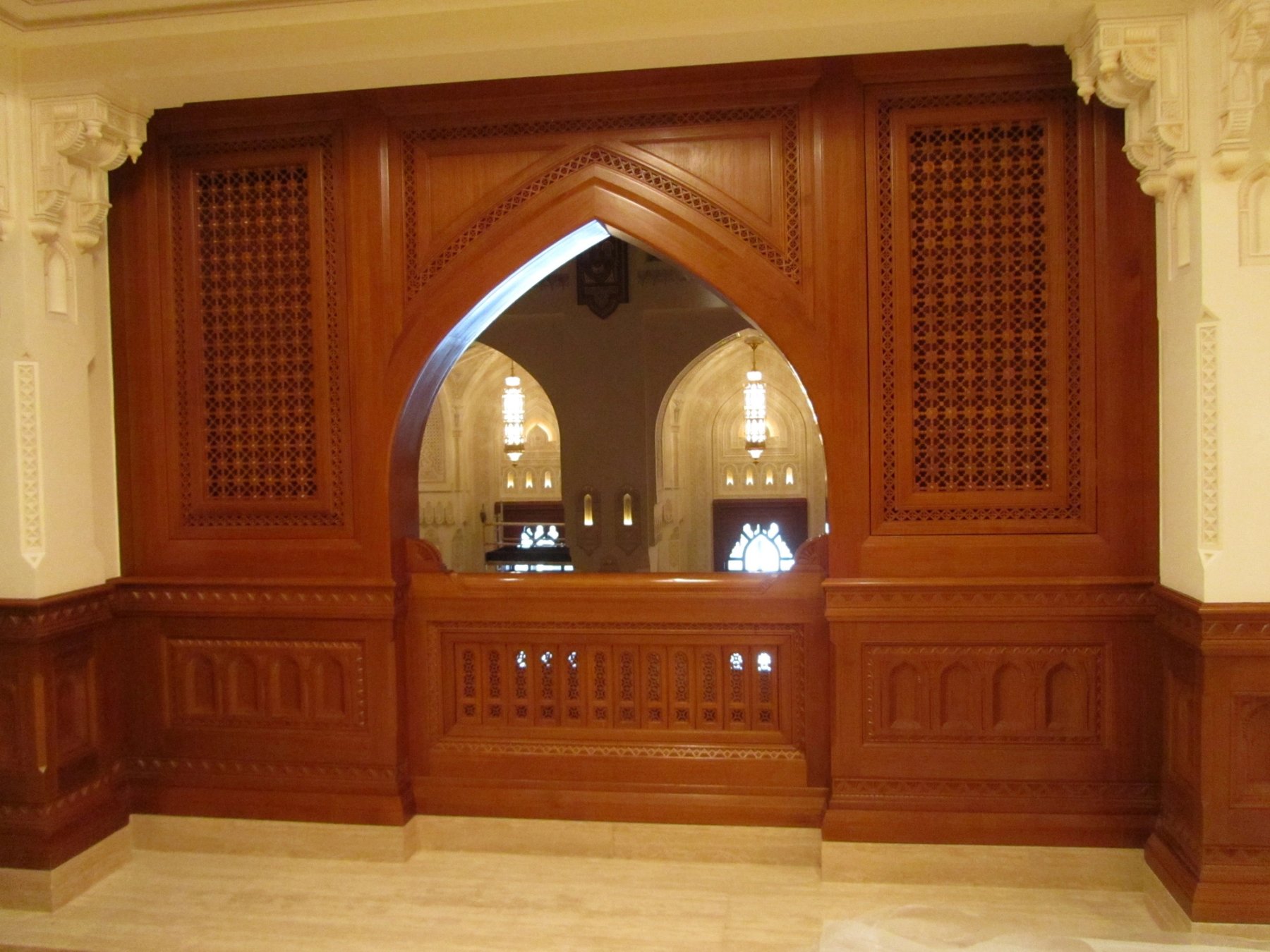 Bespoke timber arch and lattice joinery integrated within a decorative interior