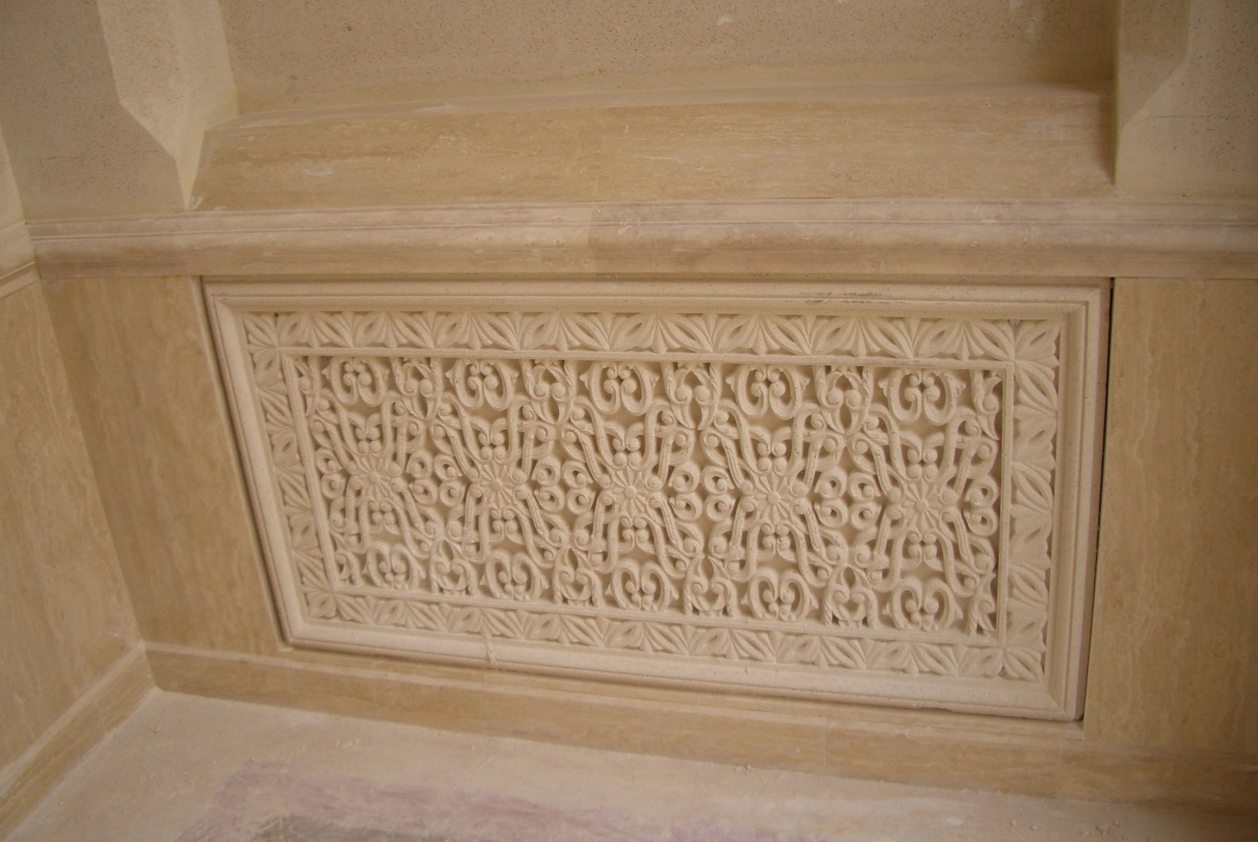 Close-up of an ornamental GRC panel with intricate floral relief