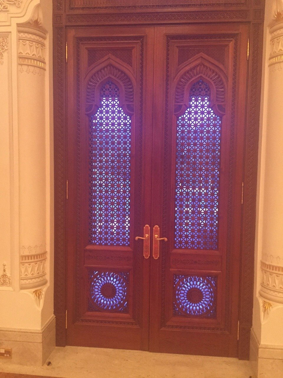 Decorative timber double doors with patterned lattice panels