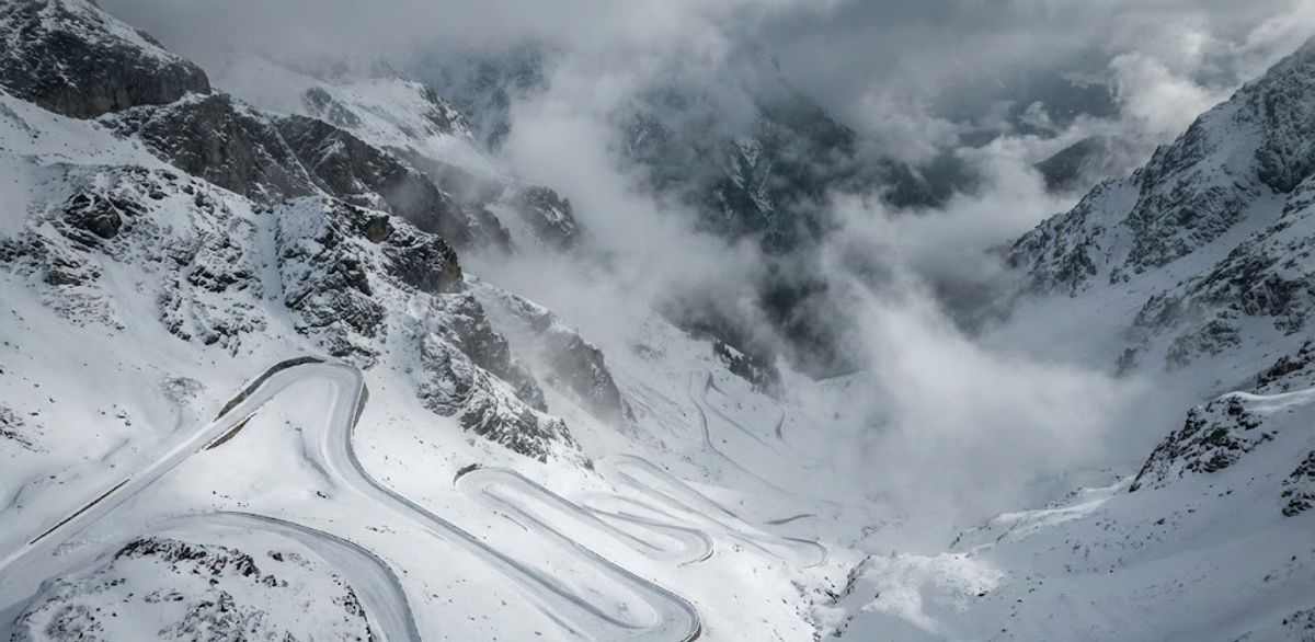 a photo of the stelvio pass, in italy, cover in mist