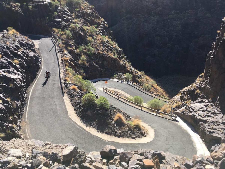 a cyclists on a mountain road 