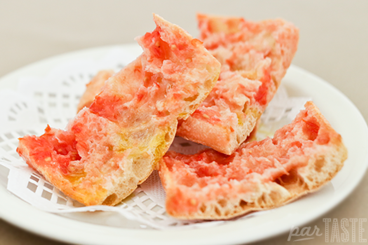 a photo of bread with tomato on - aka pa amb tomaquet in catalan