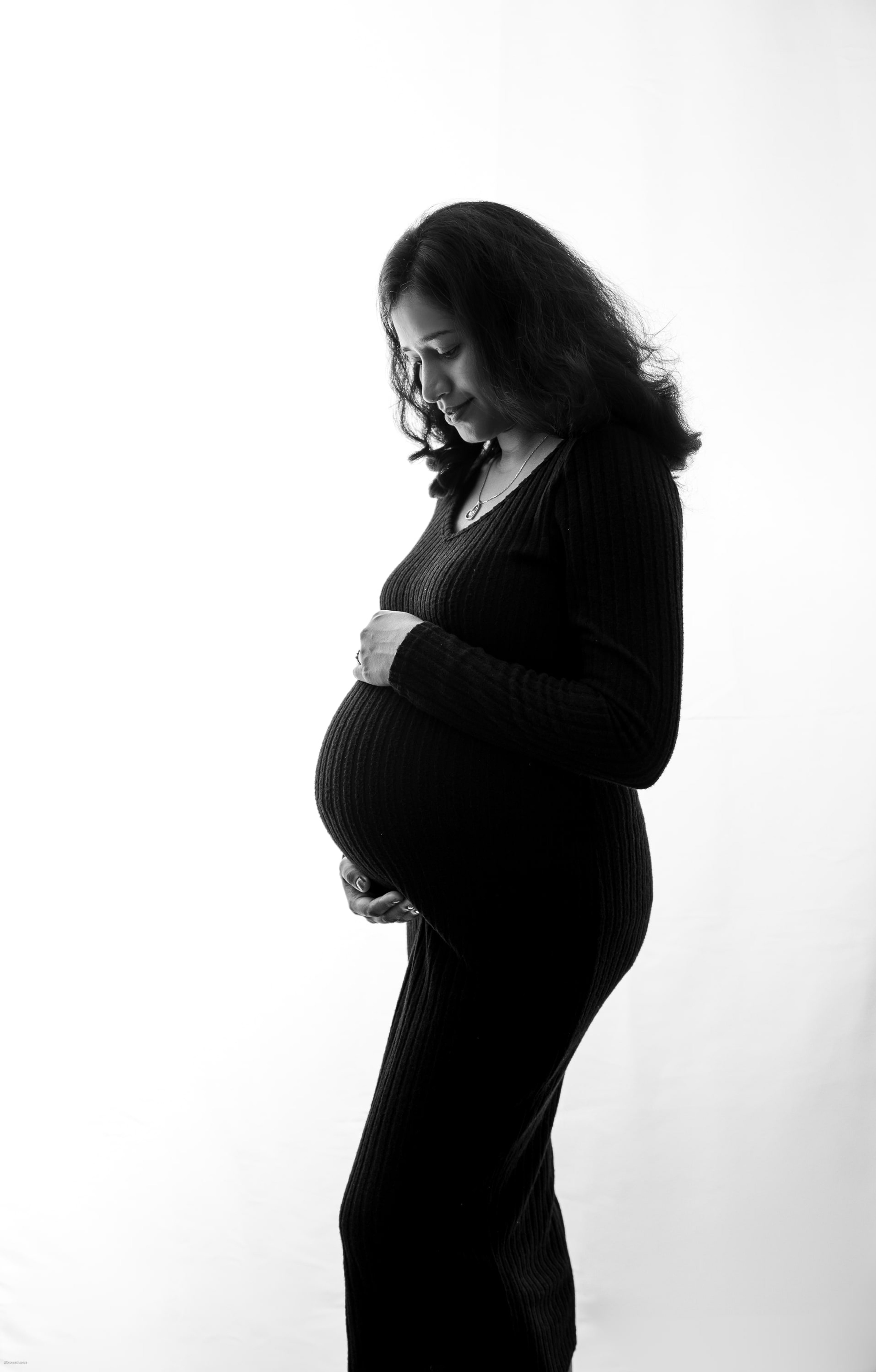Maternity silhouette in a black dress