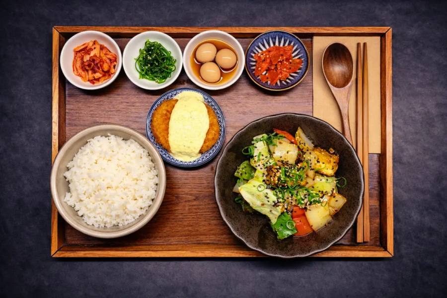 Tofu Galbi — Back by popular demand — and our galbi seasoning is better than ever. Fried tofu drizzled & tossed over the griddle with seasonal vegetables, topped with spring onions.