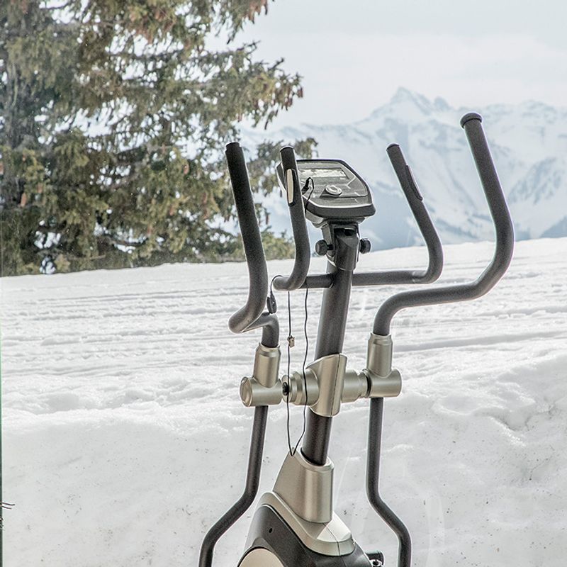 Elliptical machine with a view over the ski slopes