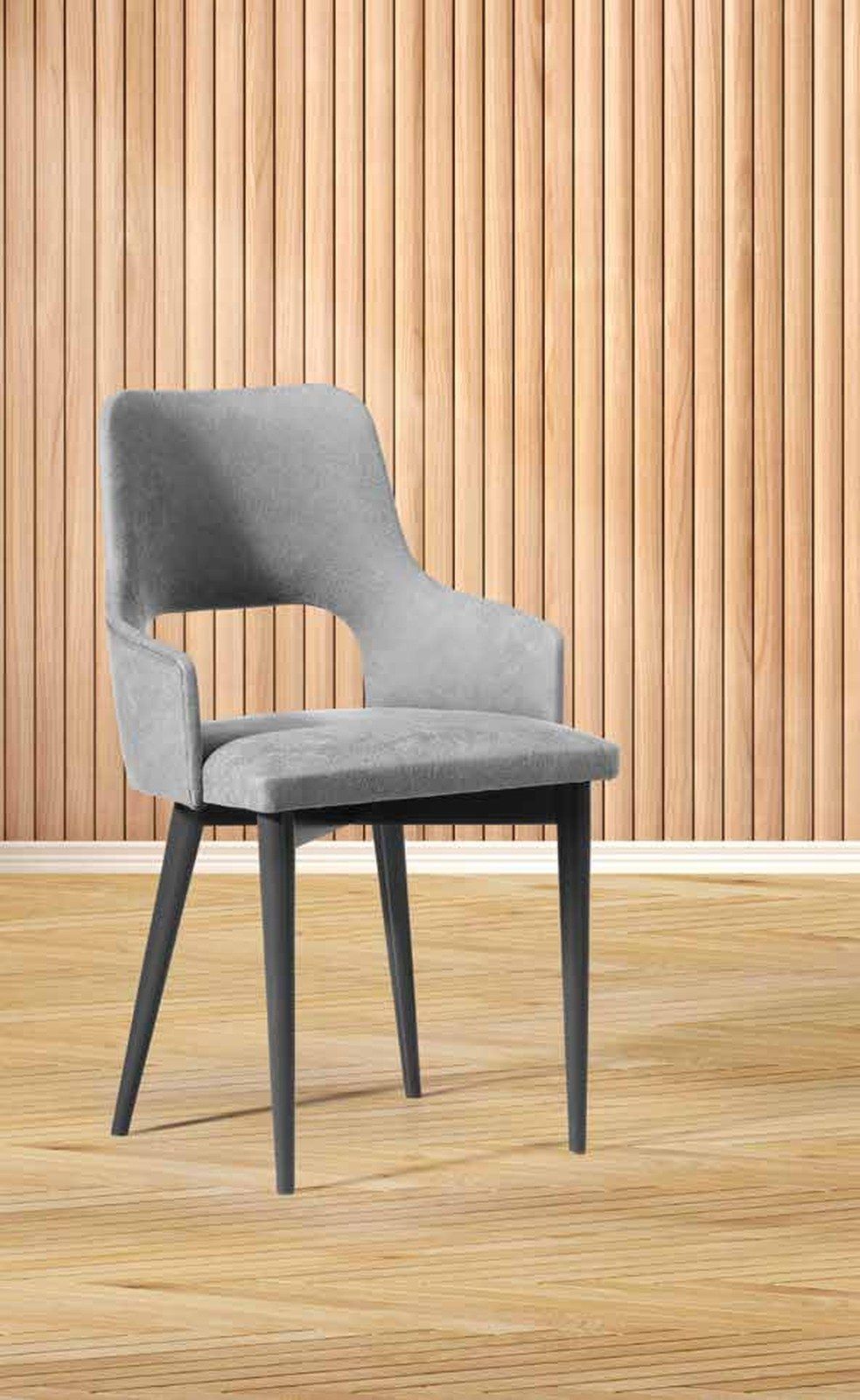 Silla de comedor modelo 204 de SG, butaca cuyo reposabrazos queda separado del respaldo por un hueco abierto, sobre pa