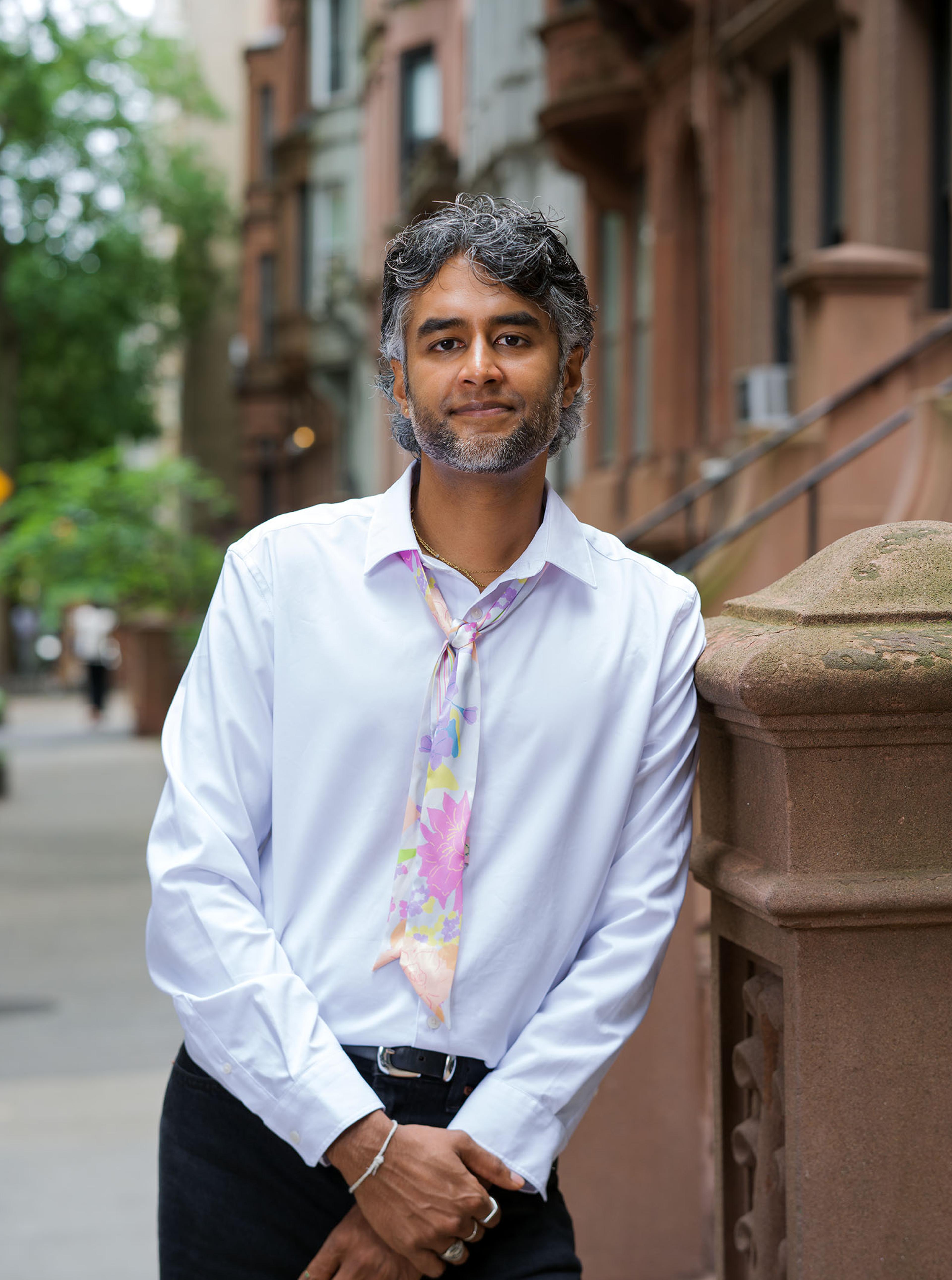 Dr. Kavin Fatehchand, MD-PhD, on a New York brownstone stoop.