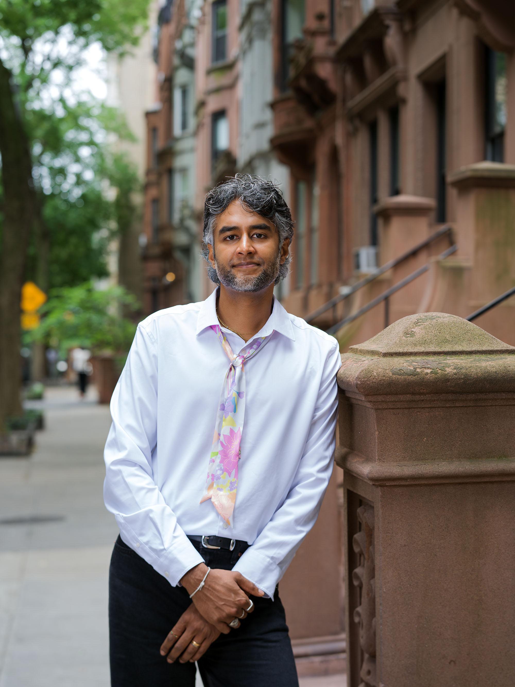 Dr. Kavin Fatehchand, MD-PhD, on a New York brownstone stoop.