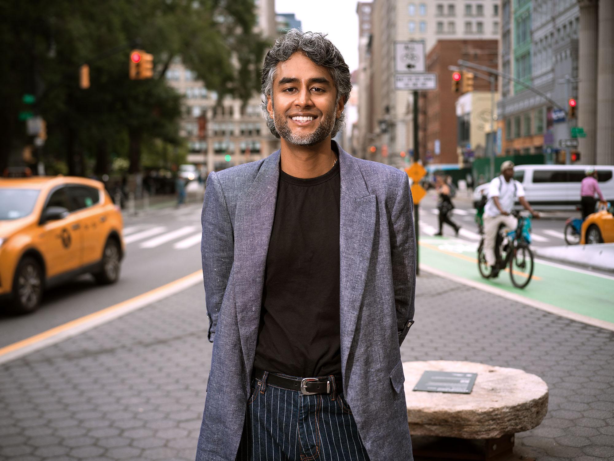 Dr. Kavin Fatehchand, MD-PhD, on a New York brownstone stoop.