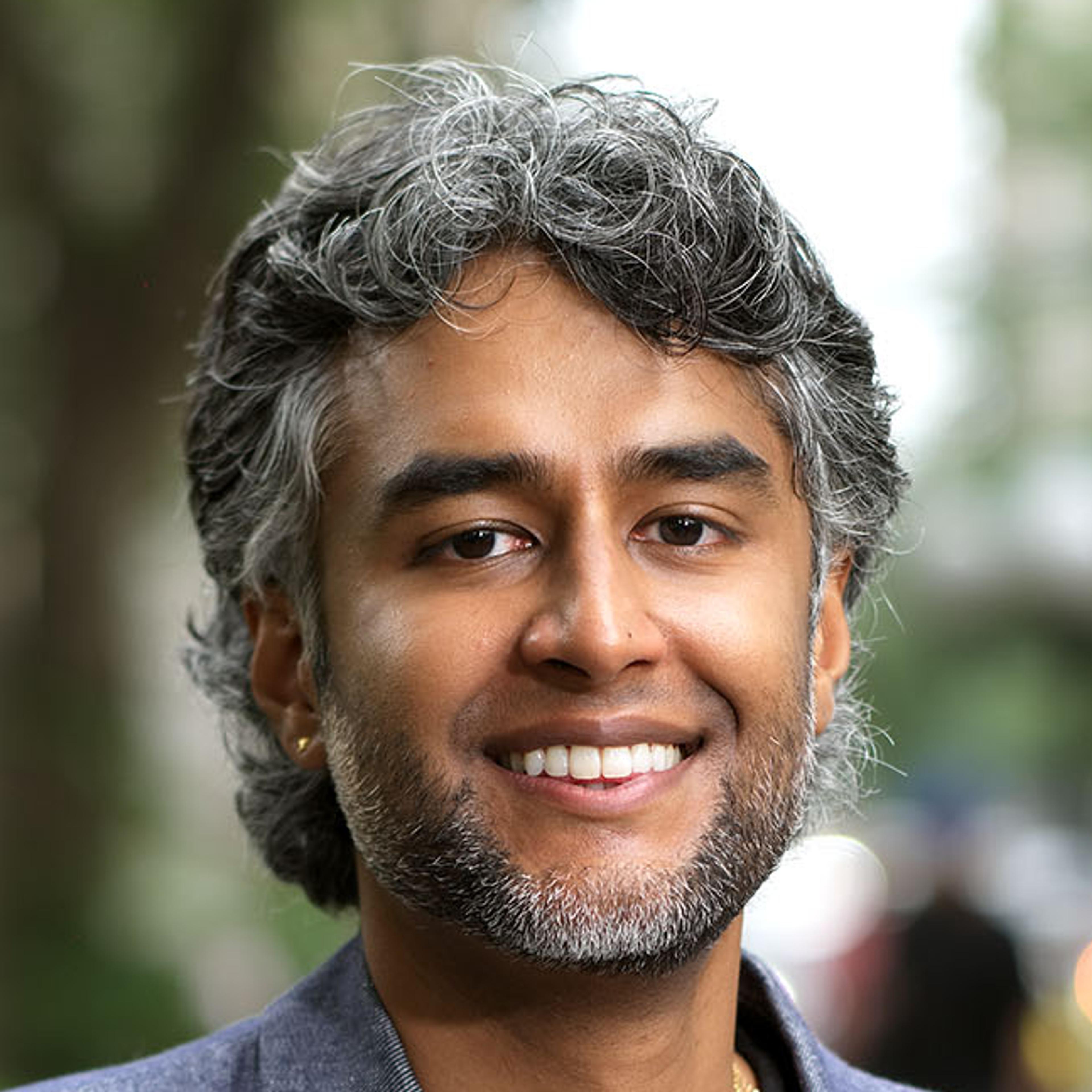 A south asian person's headshot.