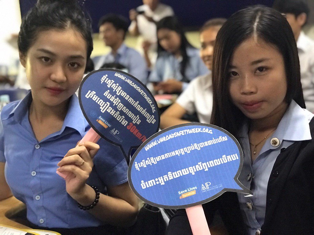 Students at Asia Euro University speaking up for road safety.