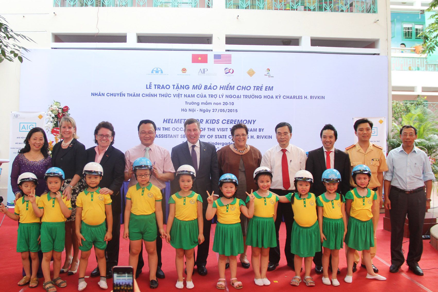 VIP guests put helmets on 20 October students with Assistant Secretary of State Rivkin