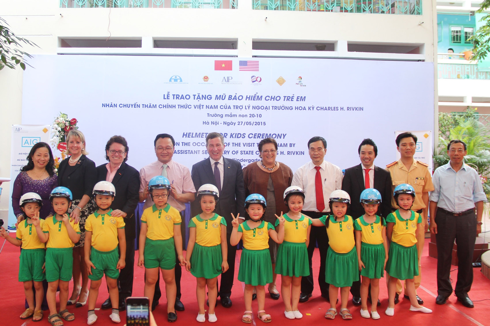 VIP guests put helmets on 20 October students with Assistant Secretary of State Rivkin