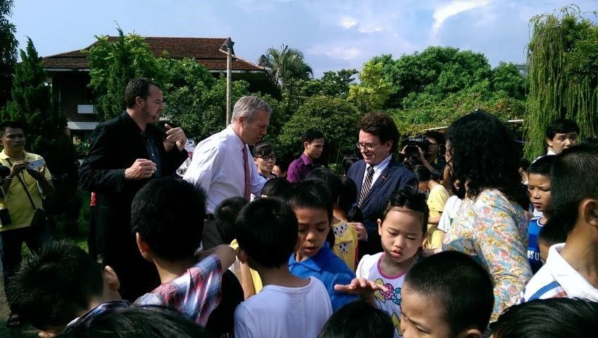 U.S. Ambassador Ted Osius and AIP Foundation President Greig Craft meet children at the SOS Village in Hanoi