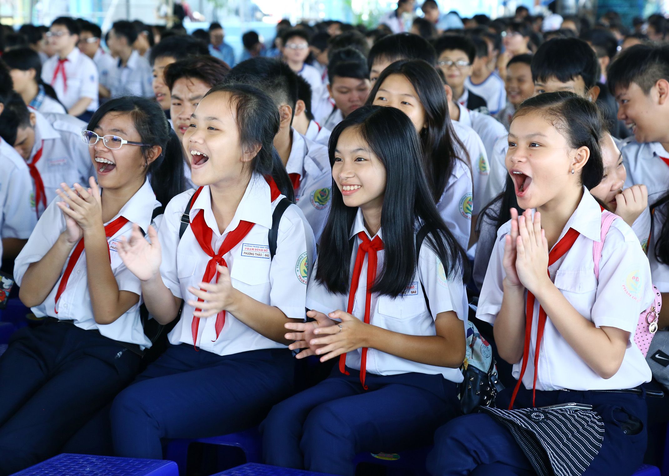 Students watch their peers discuss their photo submissions to the “Photovoice” contest in Ho Chi Minh City