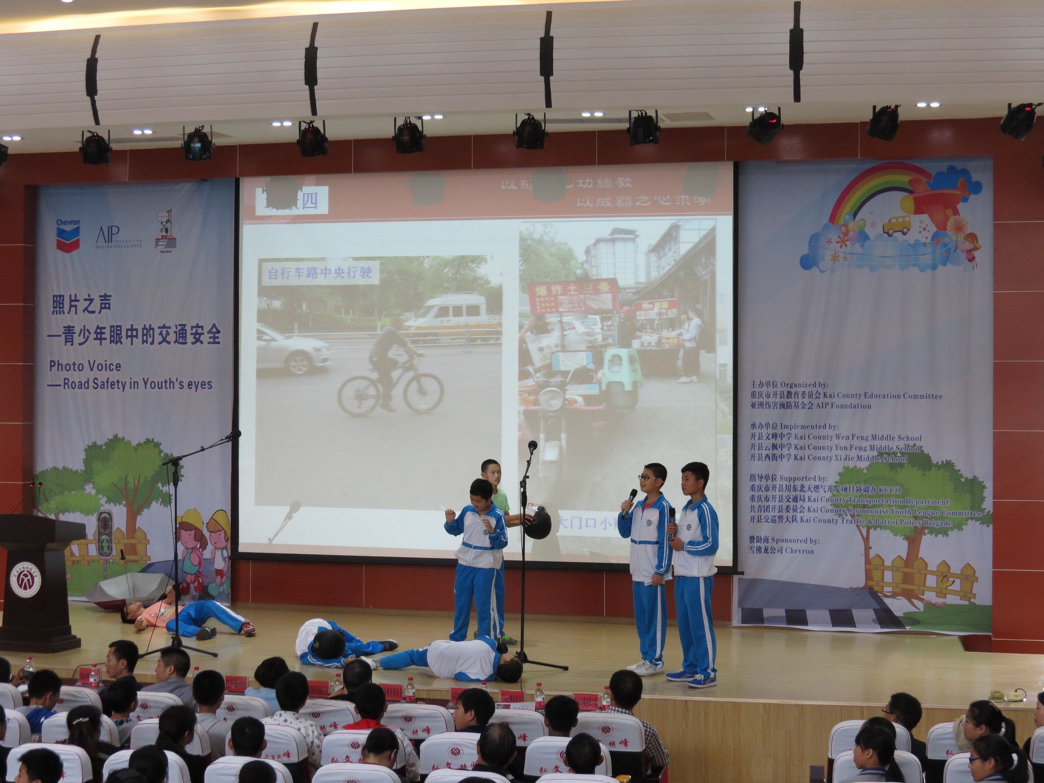 A group of middle schoolers performs a skit to accompany their photo competition entry.