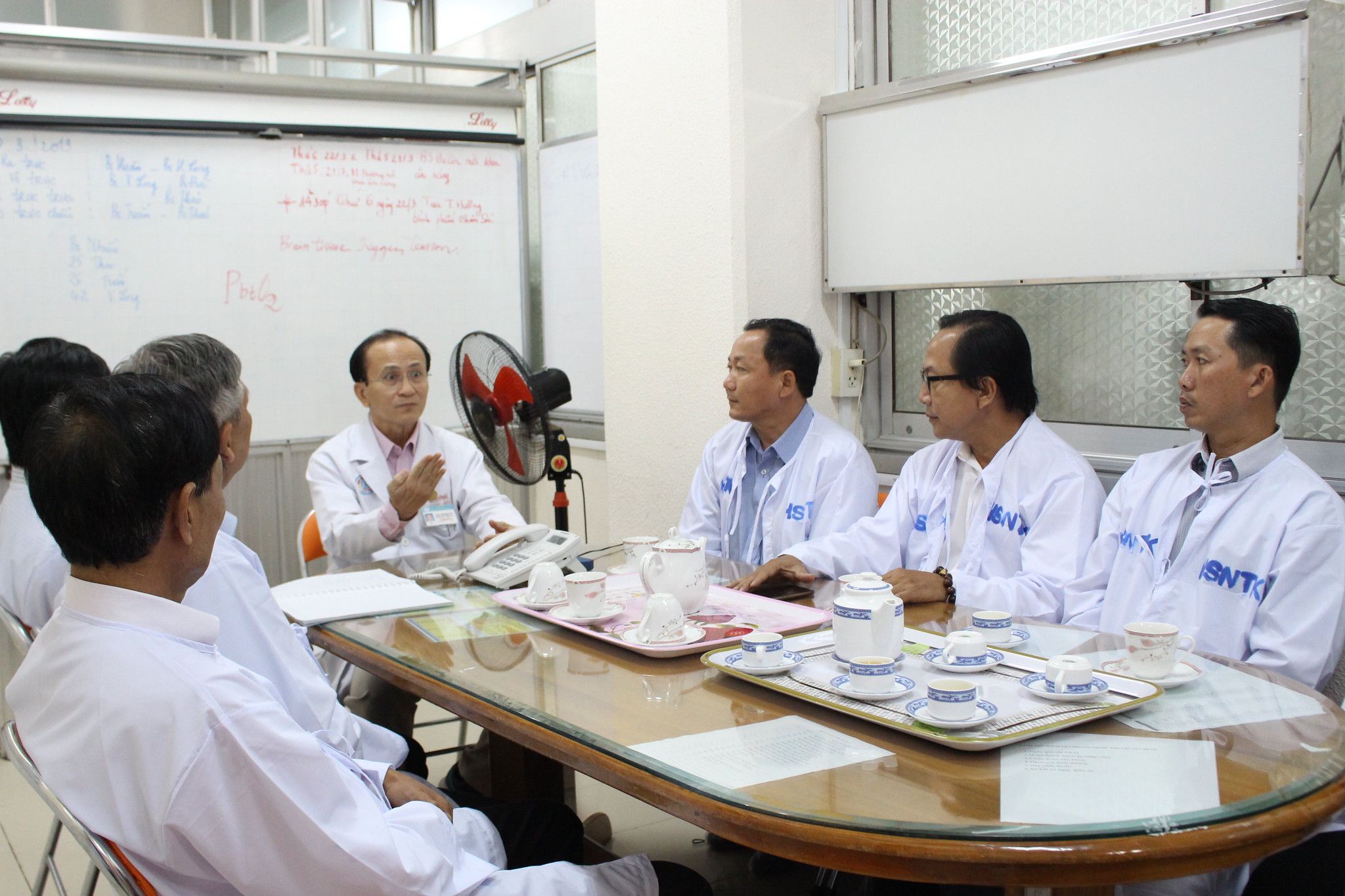 Doctors and participants discussing road crash consequences.